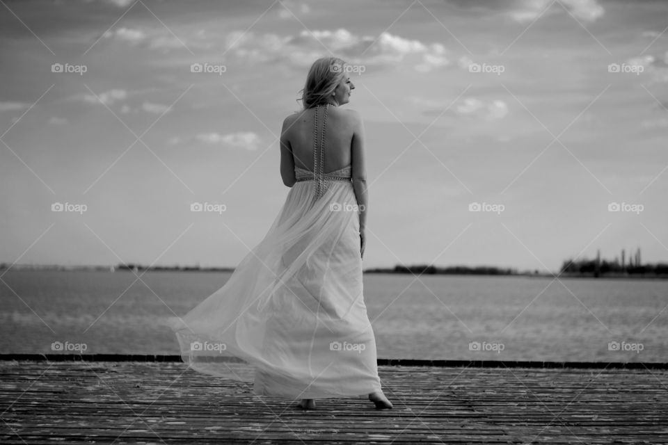 woman in the wind. woman in beautiful dress in the wind