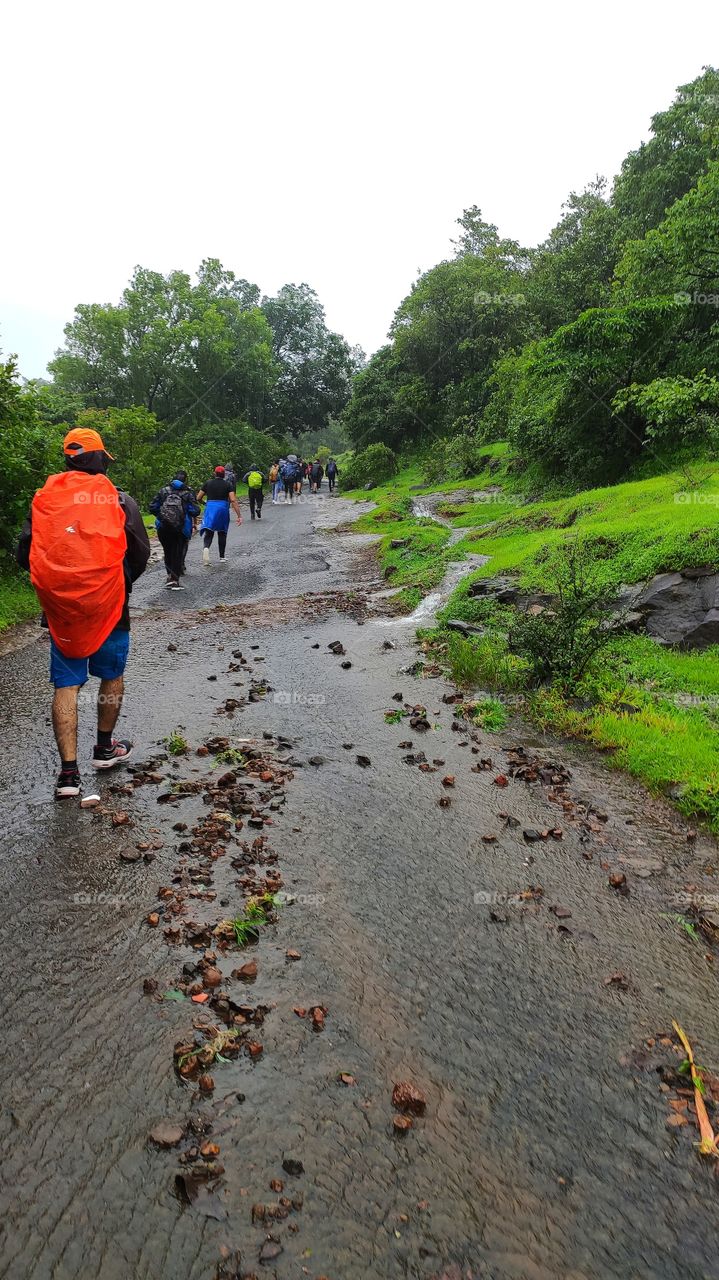 Rainy weather best time for trekking, team of 22 enthusiatic people in Lonavala all geared up with rain coats, caps, trek shoes and rappelling device to climb high mountains in waterfalls.Rain was with us all along adding to fun, takingweariness away