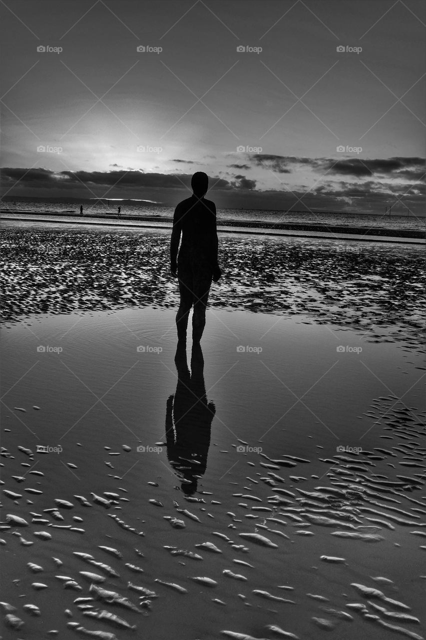 Stranger on the shore. Art, statue, beach, black and white, magic moment