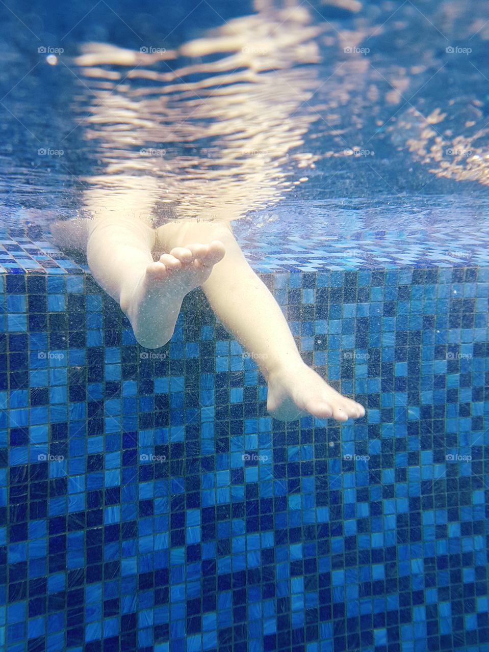 Child enjoying swimming pool