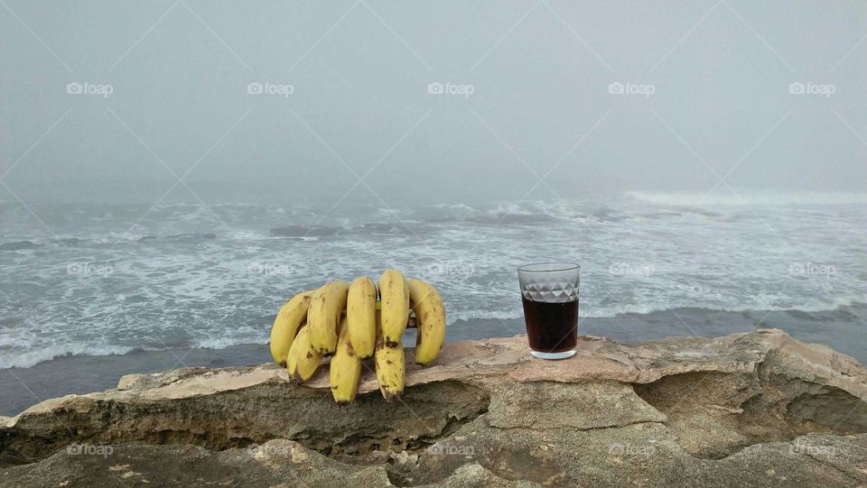 Bananas and cup of cocacola.