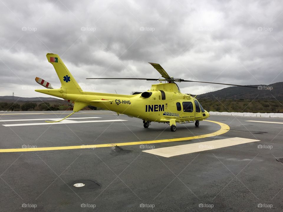 INEM - Instituto Nacional de Emergência Médica, the helicopter parked at Macedo de Cavaleiros heliport.
