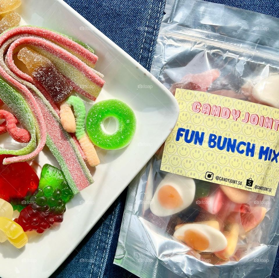 Assorted colourful rainbow fun gummies and sour strips