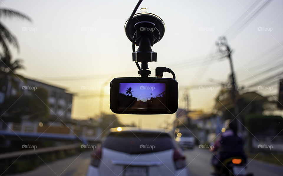 Picture cars and Sun morning on camera in car.