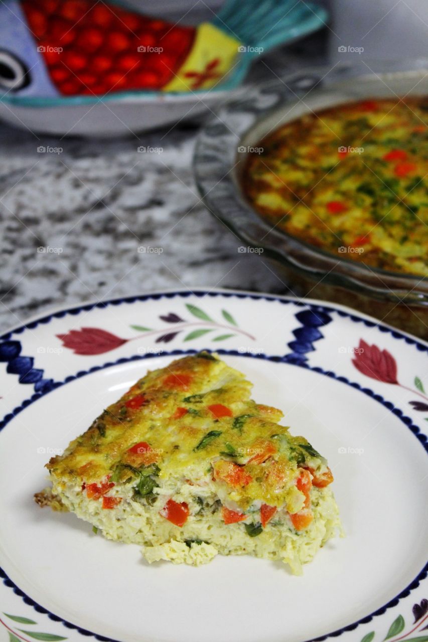 Baked frittata with roasted red peppers and arugula. 