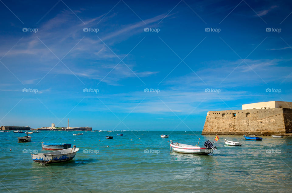 Beach in Cadiz with Fishing Boats . Cadiz beach with Fishing Boats on anchor 