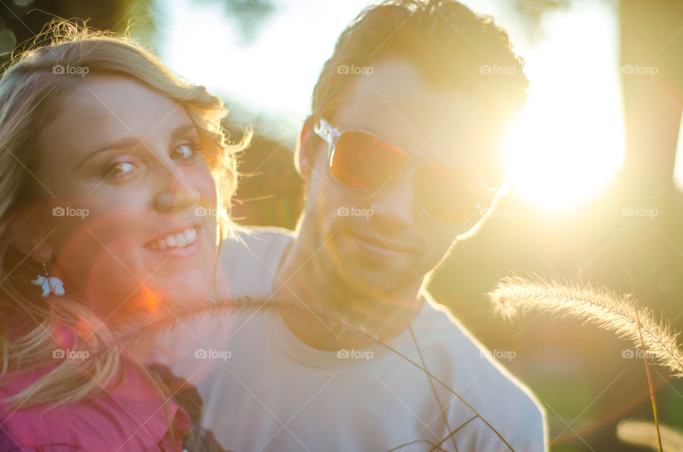 Close-up of couple with sunlight