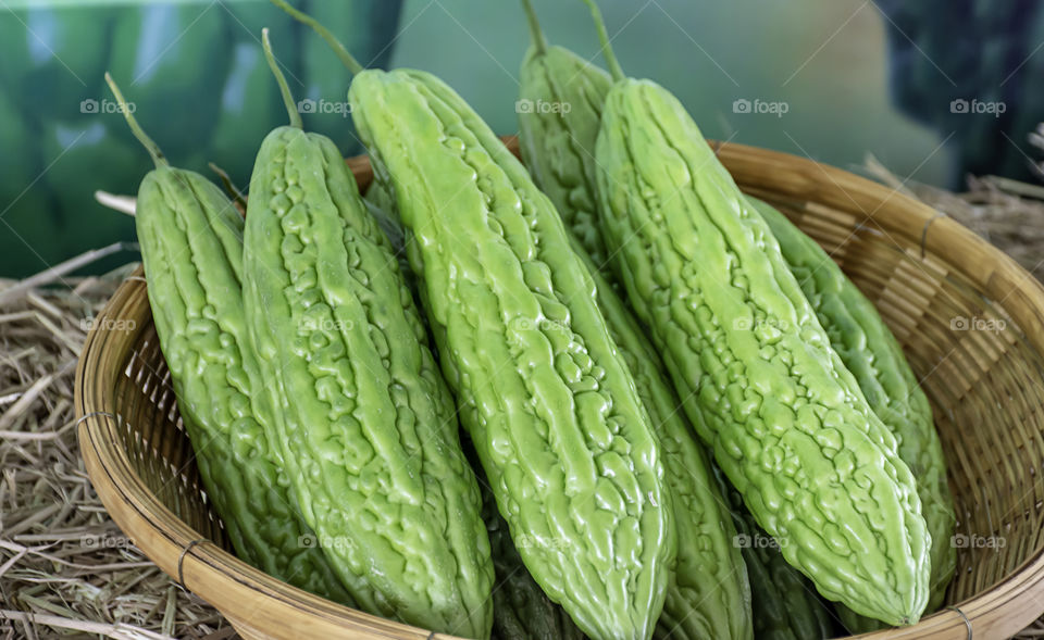 Bitter gourd fresh from the garden in bamboo baskets.