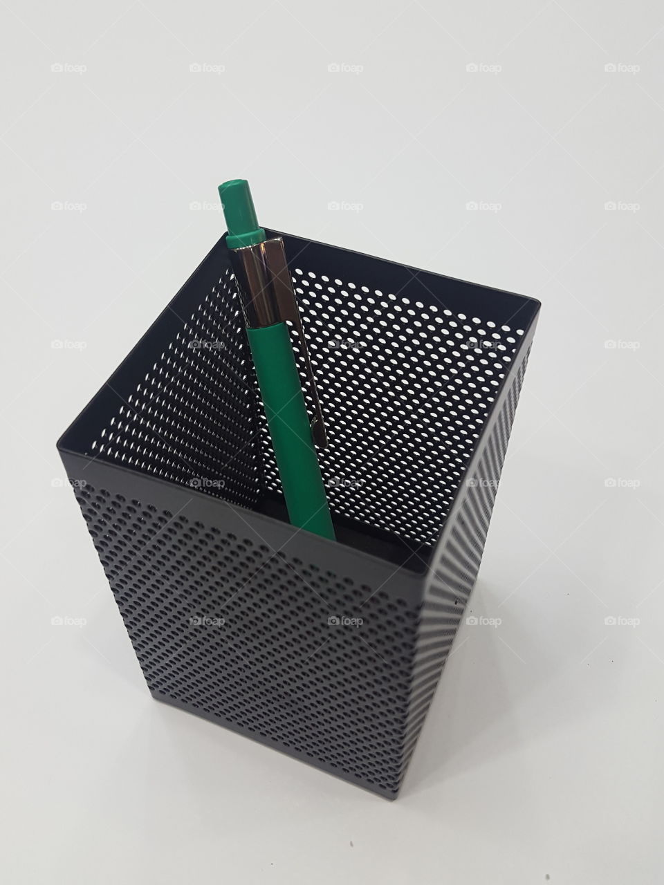 Black Perforated metal pen stand with green plastic body pen