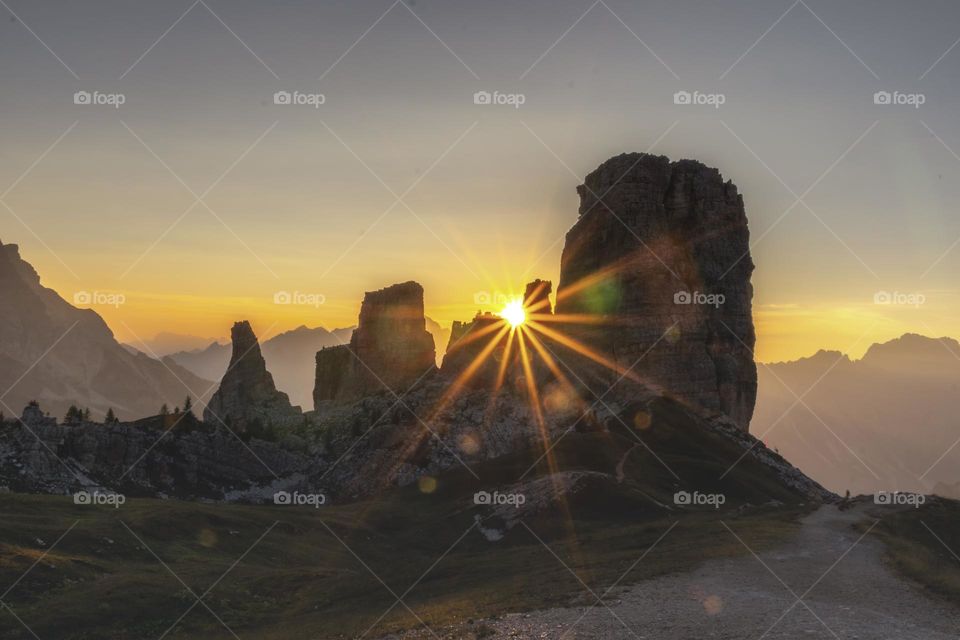 a beautiful summer sunrise on the Dolomite complex of the 5 Torri