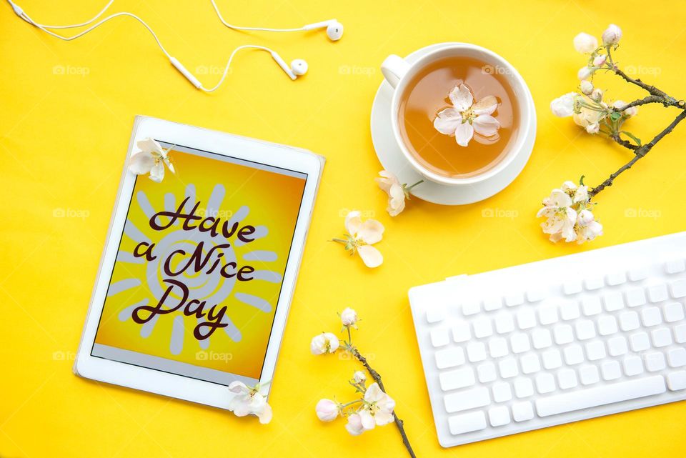 Top view on yellow work desk
