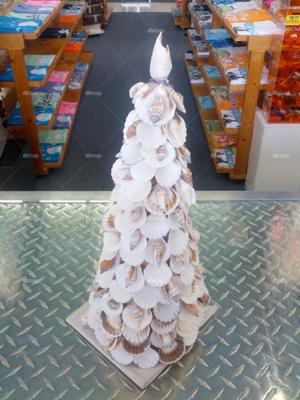 A Christmas tree made out of shells