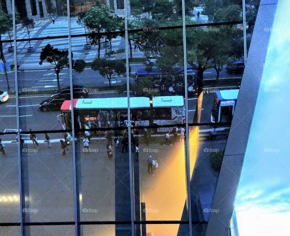 The street view on a glass curtain building at Taipei, that was special reflection.