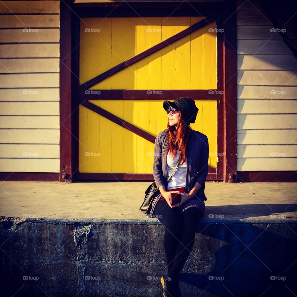 Asian woman wating for train at Hua Hin railway station.