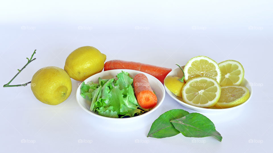 Vegetable and lemon in bowl