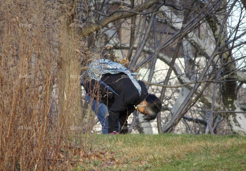 A woman fixing her shoes 