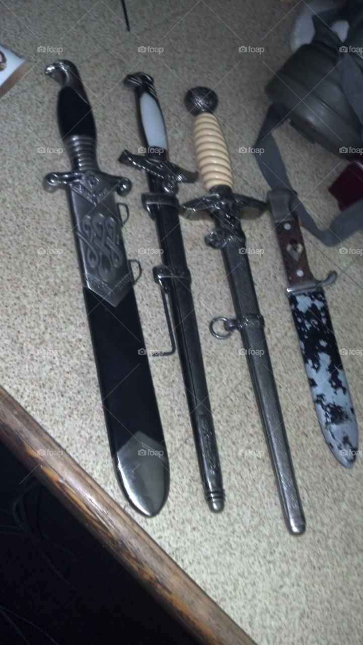 collection of swords and daggers can't tell if there old