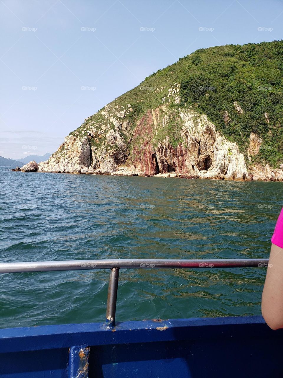 Nature seaside with some holes on the side of hill which was washed by the sea water for thousands of years. We have to reach all those holes by travelling on the boat.
