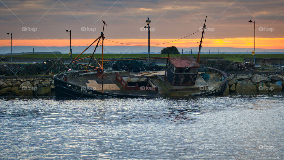 Sunken ship at sunrise