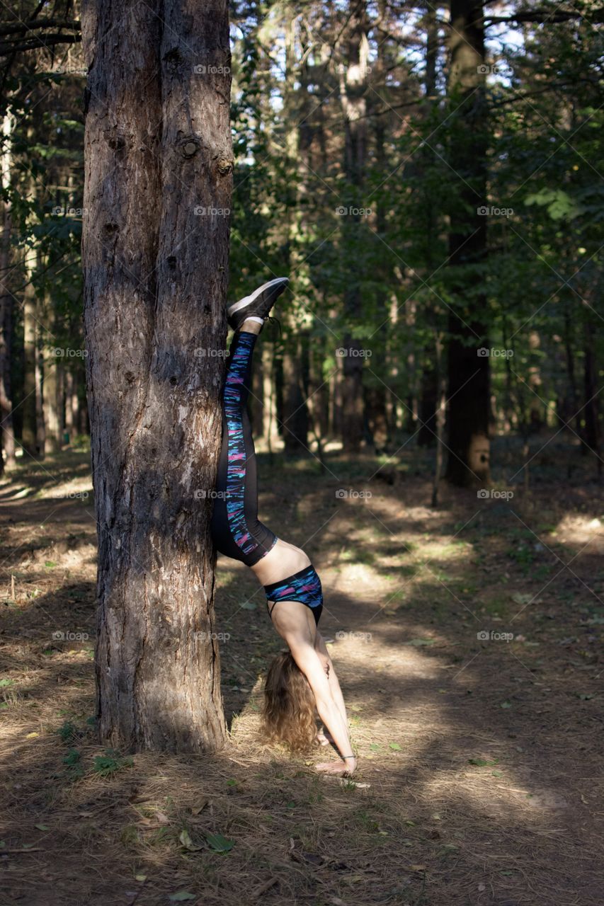 Practicing yoga in the woods. 