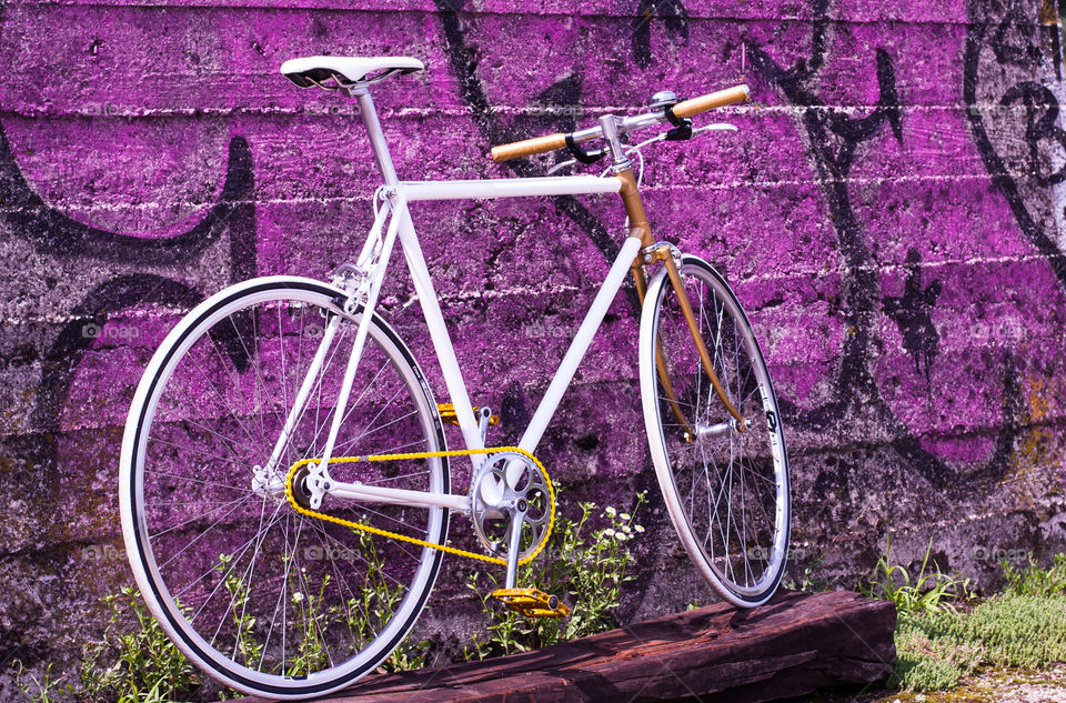 purple wall with singlespeed bicycle