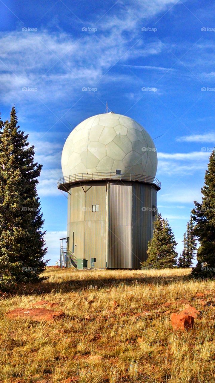 VOR, VHF omni directional radio Range. Used to provide information to aircraft to keep them on course and instrument landings at nearby airports such as Aspen's airports in Colorado.