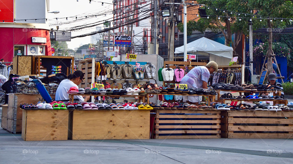 Local vendors preparing their products to be displayed in an open market