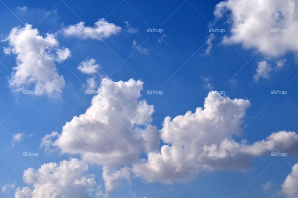 Blue sky and clouds. Beautiful sky in the summer.