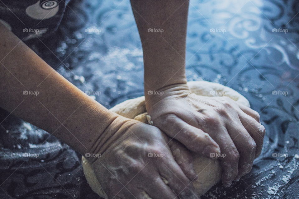 Close -up hand kneading dough