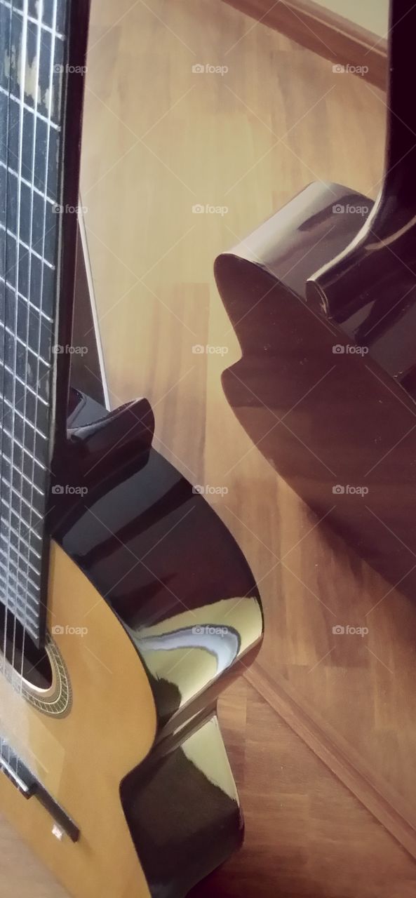 Guitar reflecting in mirror