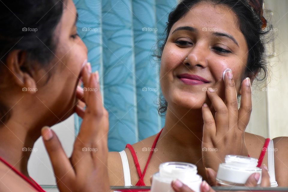 Woman applying cream