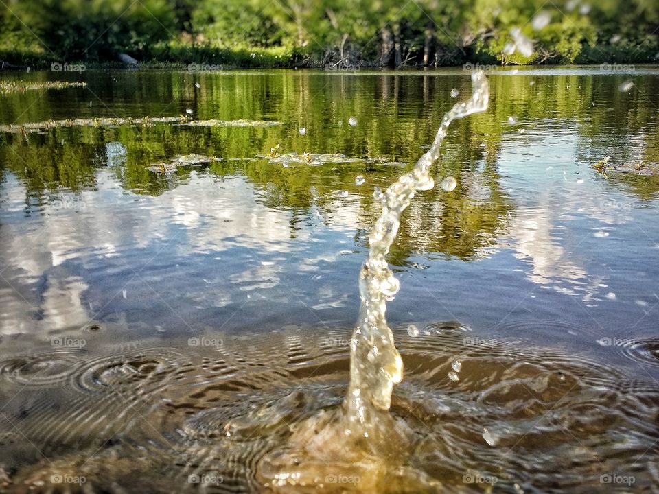 The Splash After Throwing Rocks in a Lake