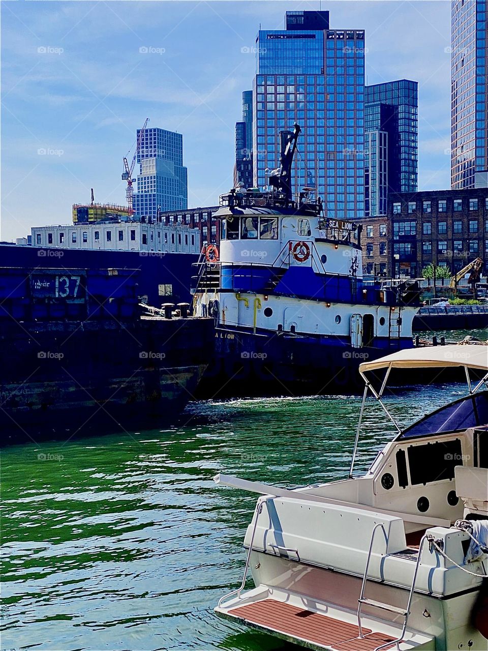 The wheelhouse of the extremely long barge that passes us by on a glorious Indian summer day at “Newtown Creek” by the “Pulaski Bridge” in LIC, Queens is literally “right in your face” to use a well known colloquialism. 2023. Hypnotic Productions