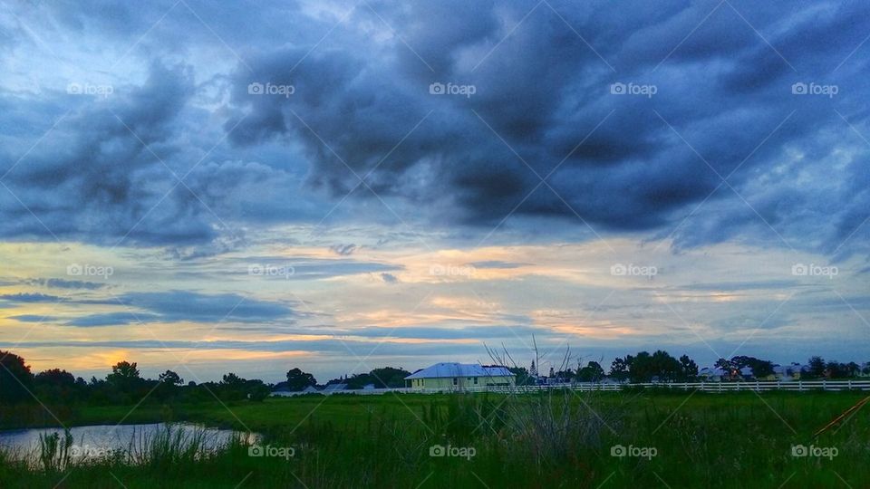 Cloudy sky over the green land