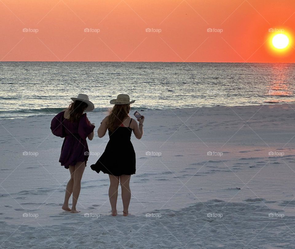 Cowgirls on the beach enjoying the January sunset on the Gulf of Mexico - If you are in a beautiful place where you can enjoy sunrise and sunset, then you are living like a king or queen.