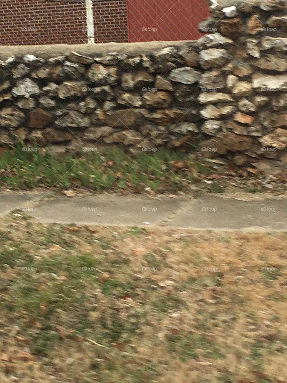 Interesting handmade rock wall. Part of a schools property. 