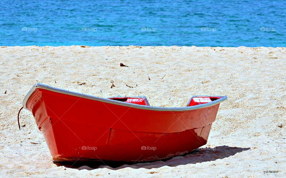 red boat and the sand