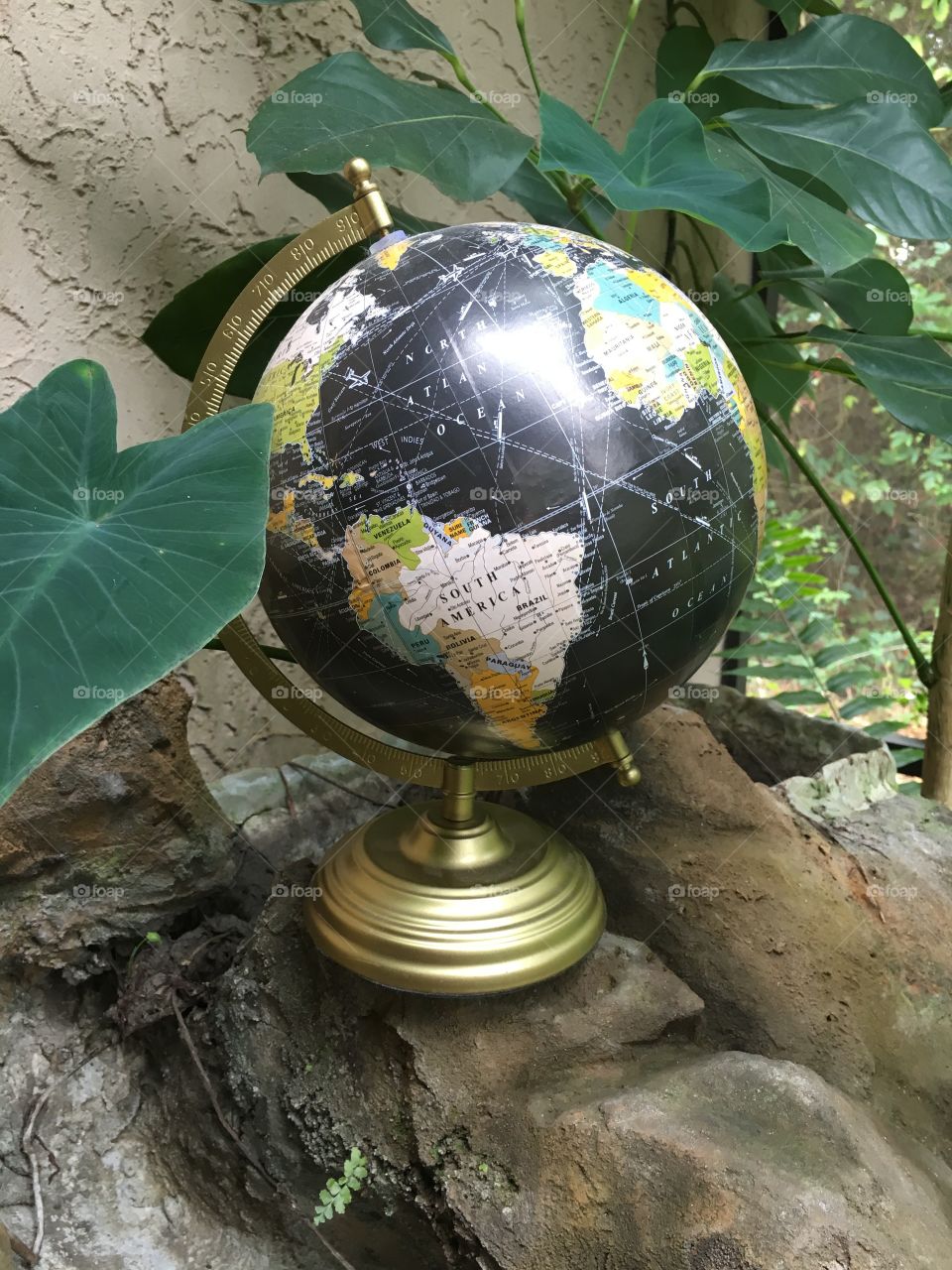 Globe on a rock