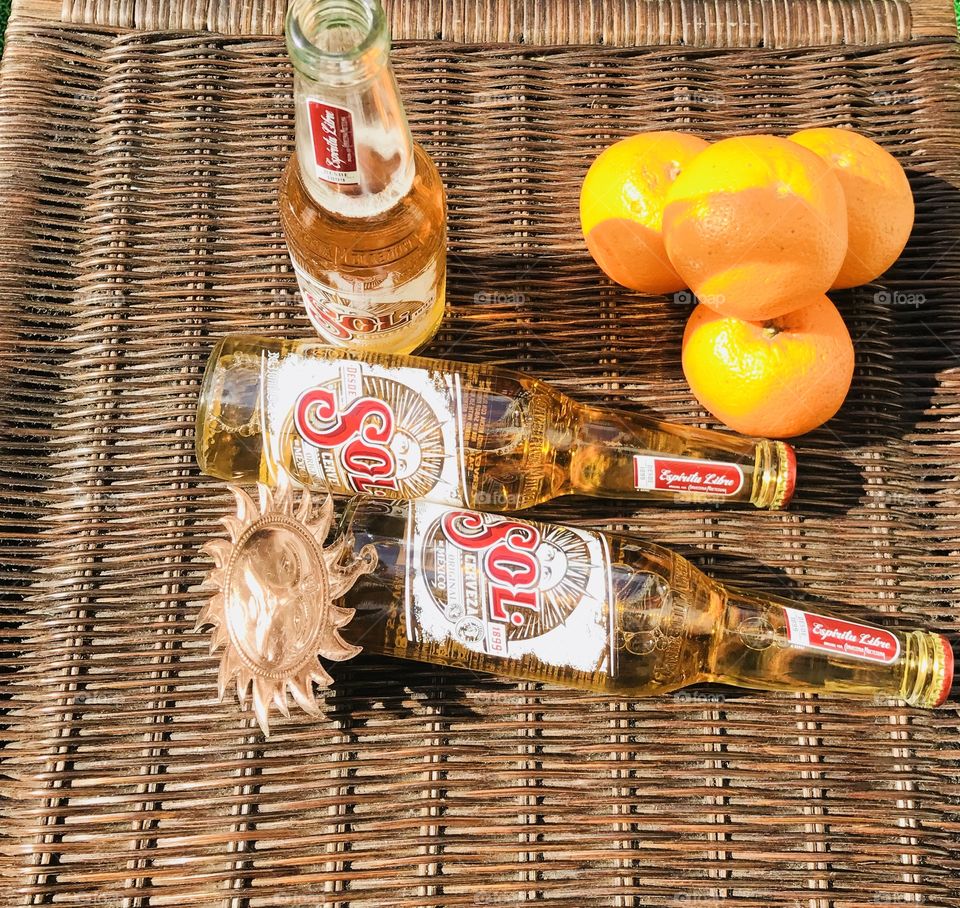 Enjoying sol beer in summer With symbol of sun