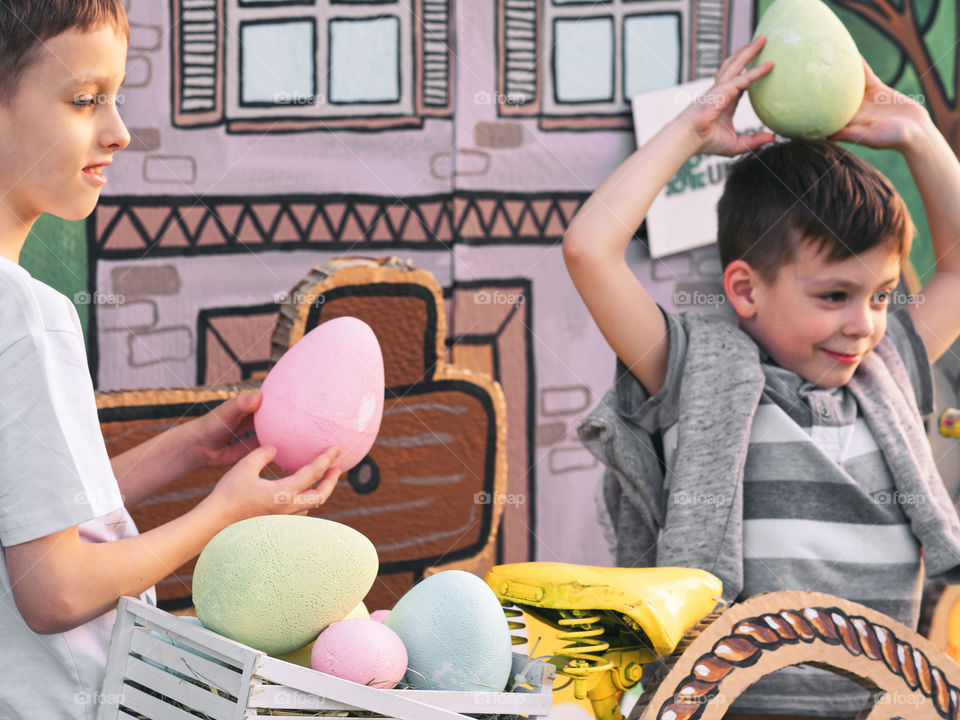 Two boys playing with easter eggs