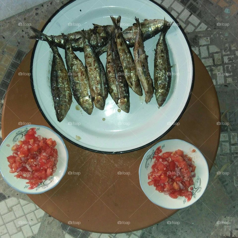 Plate of fish and tomatos