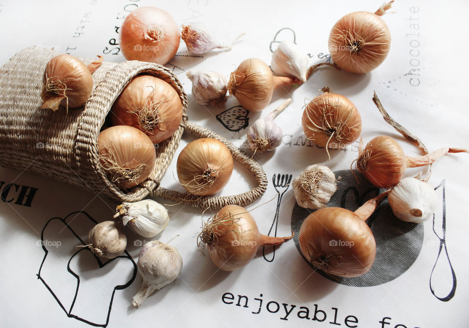 Cooking time, onion and garlic on the table