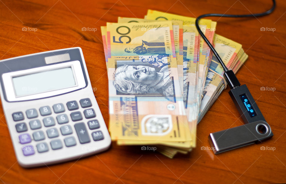 Calculator, Australian dollars and Ledger wallet