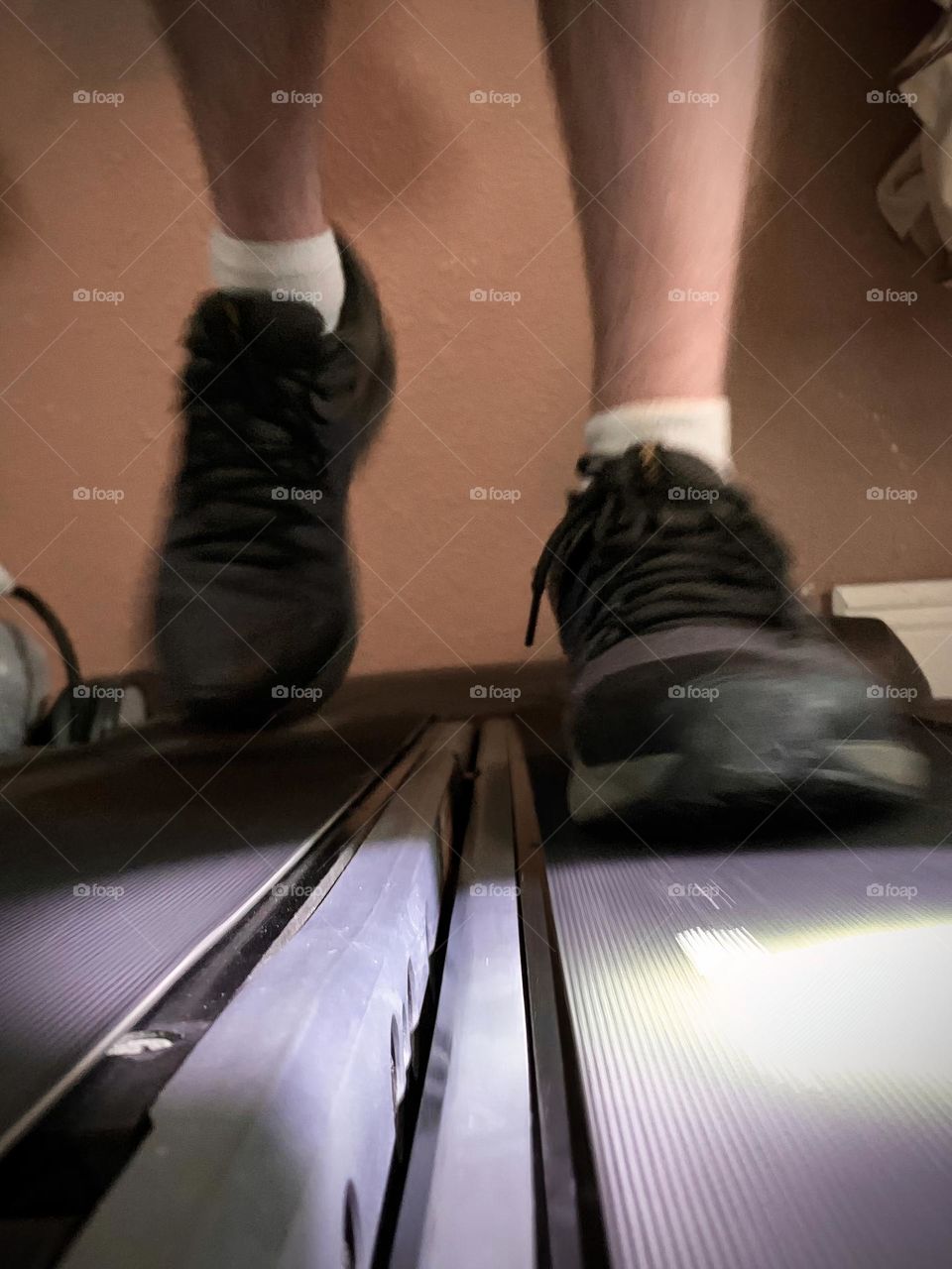 Treadmill Exercising With Determination Feet Close-Up