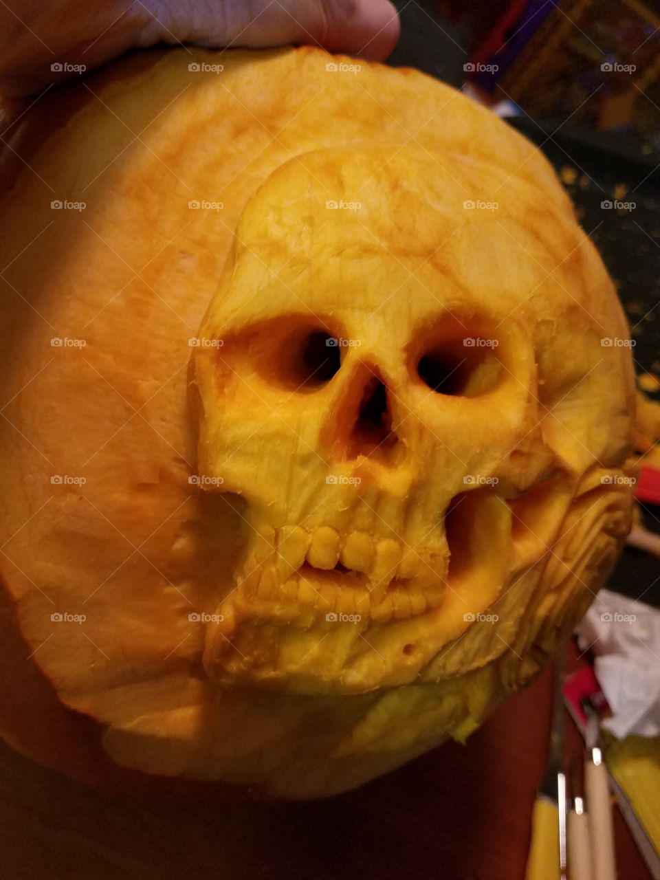 Picture of the skull, looking directly into it's eyes & nose, during the extreme pumpkin carving process...