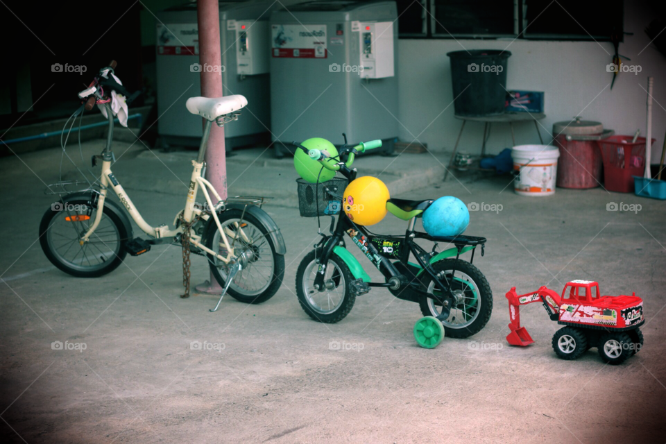 Bike together . Children's bicycle and toy car