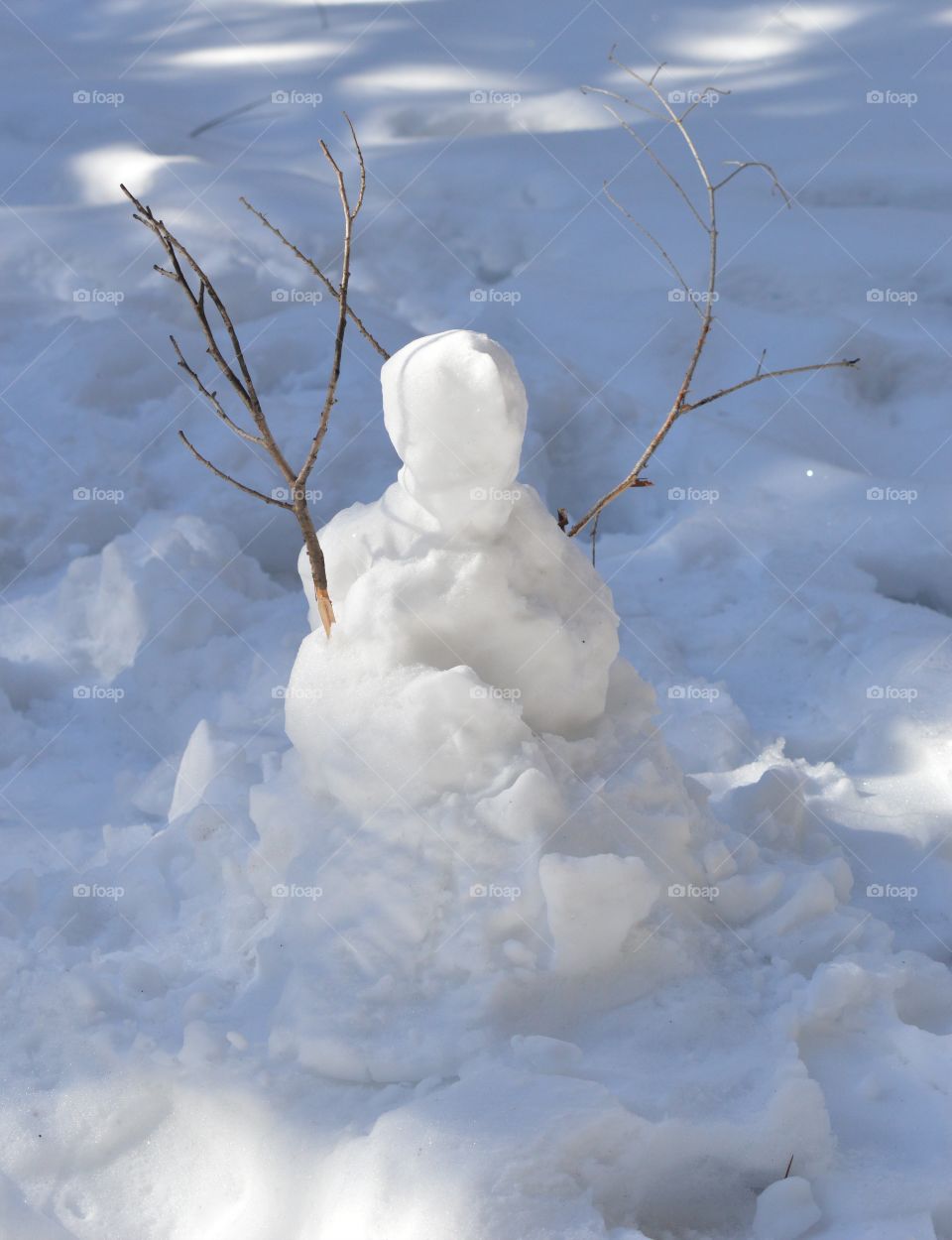 winter snowman with twigs for arms