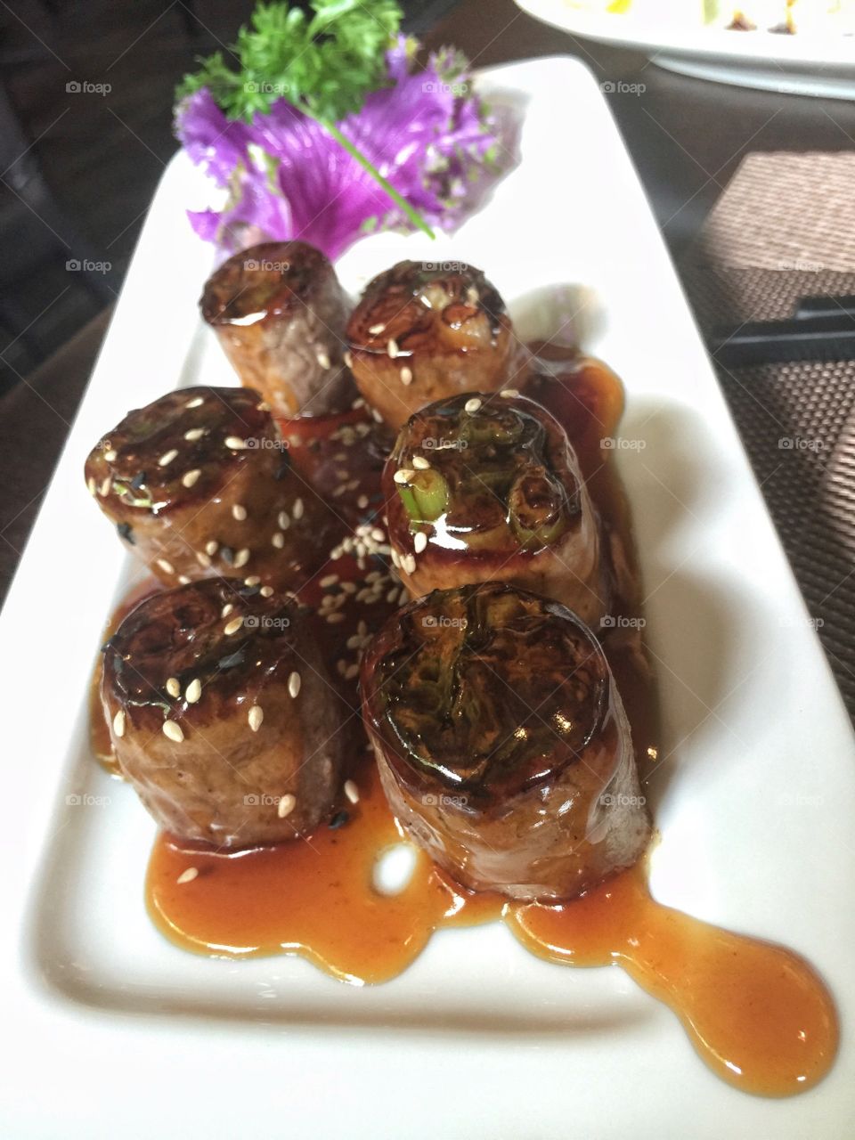 Scallions wrap in beef Asian