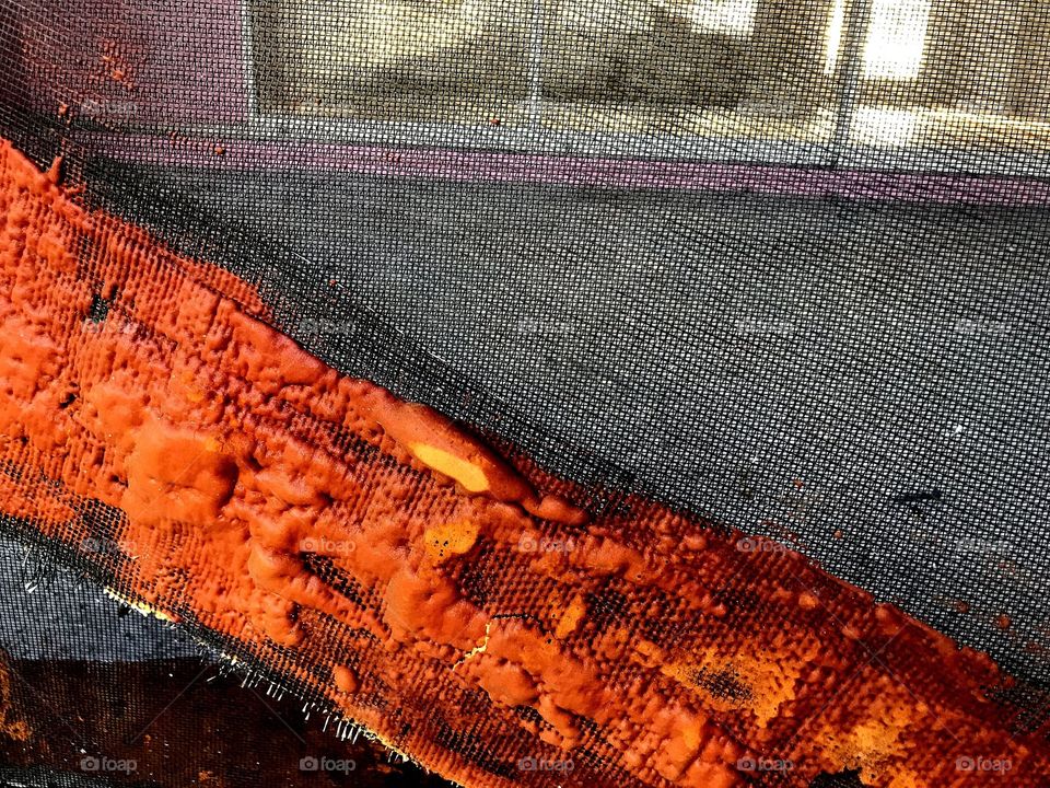 Layers of rust on screen-creative texture 