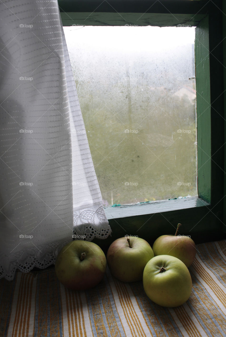 Apples on the window of the country house